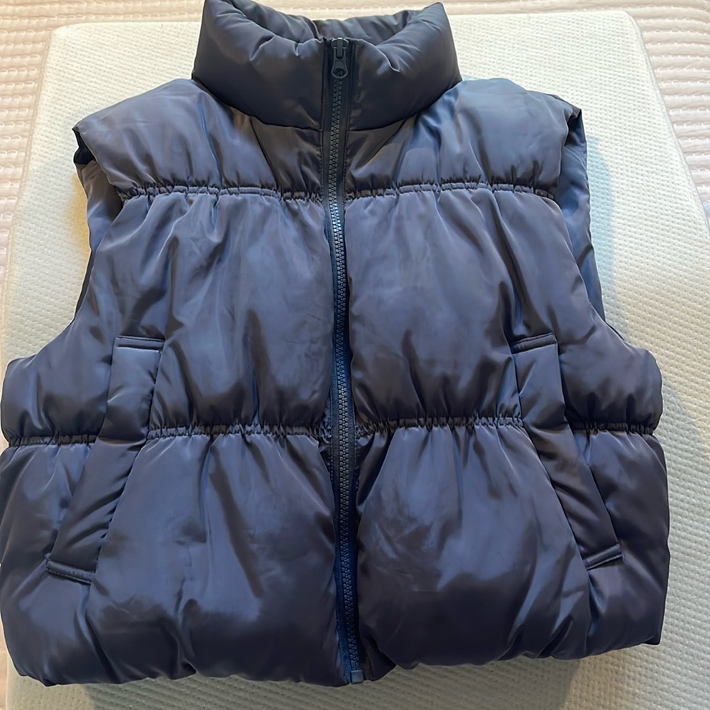 Young girl padded vest size large. Wind and water resistant